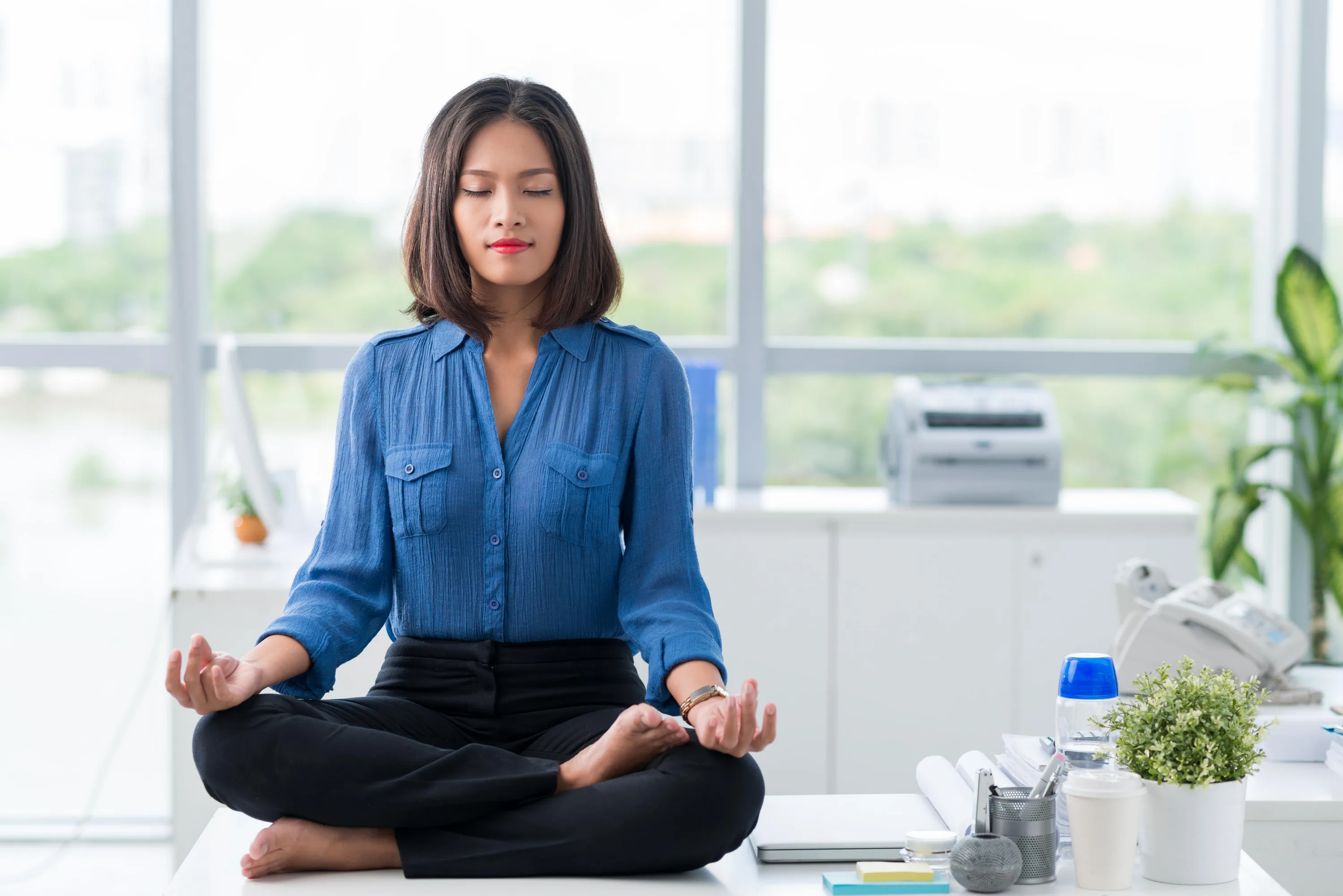 Person practicing mindfulness meditation for stress management